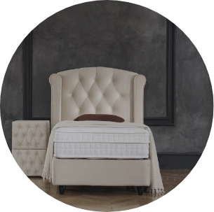 Eenpersoons boxspring met gecapitonneerd hoofdbord